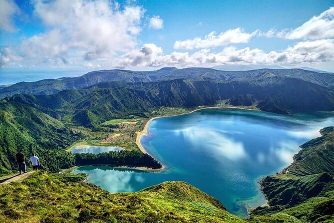 Among Whales Dolphins and Volcanoes Full Day Tour With Lunch - Waterfalls, hot ground, and a black-sand beach