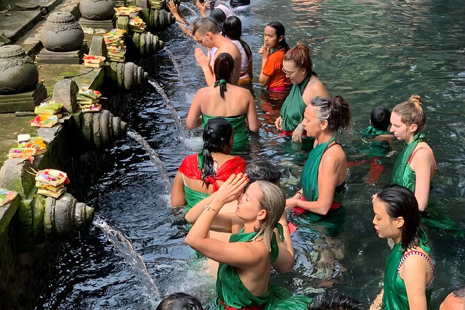 Bali Tour: Village, Volcano, Holy Spring Temple, Waterfall Tour - Tegenungan Waterfall: a lively final stop