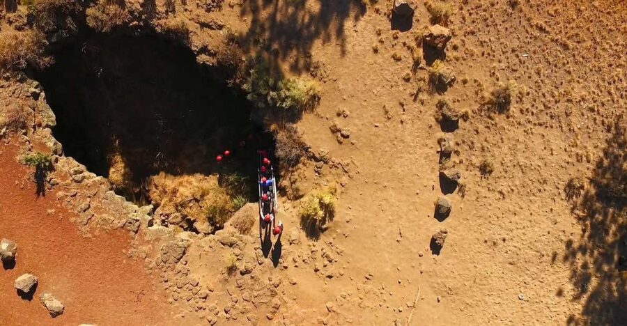 Bend: Half-Day Lava Tube Cave Tour - Getting ready with a helmet and headlamp