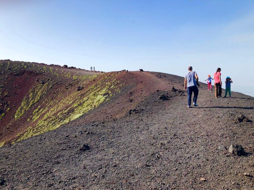Catania: Etna Morning Excursion with Tasting and Pickup - Entering a lava cave with a helmet and flashlight