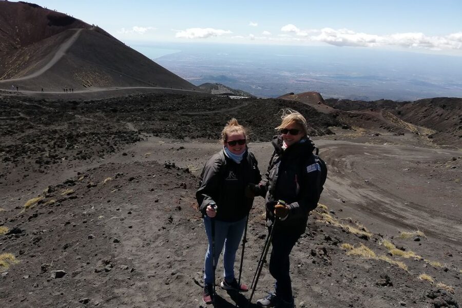 Catania: Mount Etna Trekking Tour Beyond the Tourist Trails - The volcanic sand descent and lava cave
