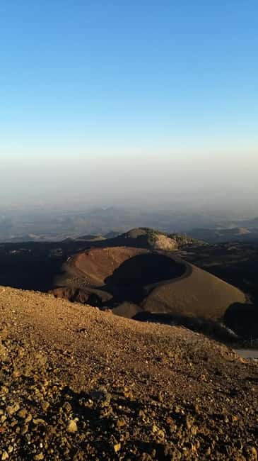 Etna: Jeep excursion and hike suitable for everyone. Free shoes and jacket - Entering Grotta delle Nevi with a helmet and lamp