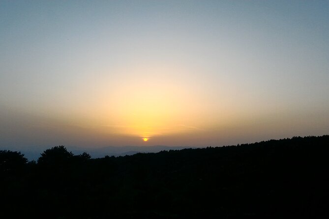 Etna Sunset - Inside a lava cave with helmets and torches