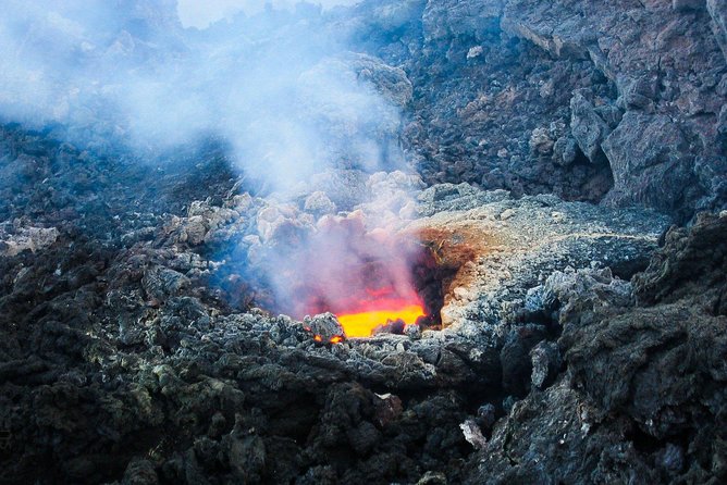 Etna & Taormina from Catania - Inside a volcanic cave with helmet and torch