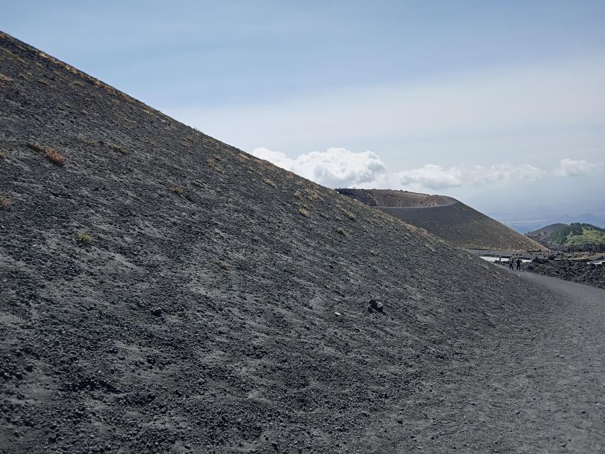 Etna walking tour, visit of a lava tunnel, Arancino tasting - A free hour in an Etna town