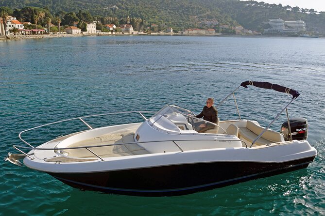 Explore Santorini and its volcanic wonders with Alex Private Boat - A private view of Santorini from the water