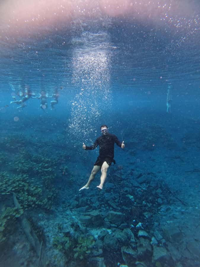 From Flores: Blue Crater All Inclusive - The river crossing and 30-minute speedboat ride