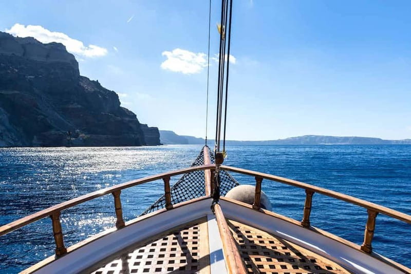 From Thera: Thirasia Cruise w/ Volcano Hike and Hot Springs - Sailing away from Athinios with the caldera in view
