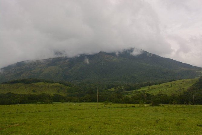 Miravalles Volcano and Waterfalls from Playa Hermosa - Llanos del Cortez Waterfall comes first