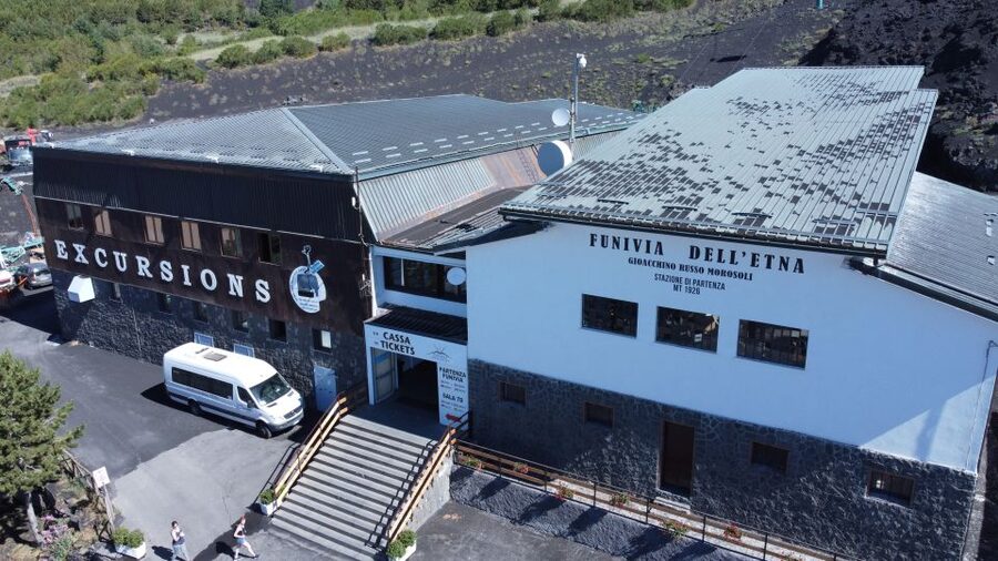 Mount Etna: Return Funivia dell'Etna Cable Car Ticket - At the upper station, craters above and coastline below