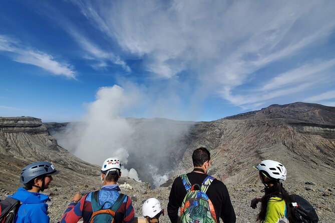 Private E-MTB guided cycling around Mt. Aso volcano & grasslands - The downhill return and wide caldera views