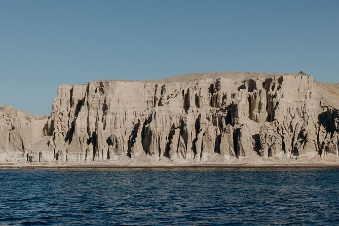 Santorini Semi-private Morning or Sunset Volcano Sailing Tour - Red Beach offers color, not a long swim