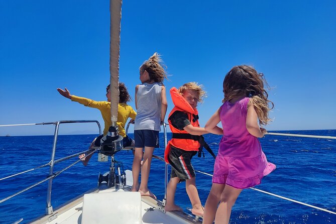 Santorini Semi-private Morning or Sunset Volcano Sailing Tour - White Beach is best appreciated from offshore