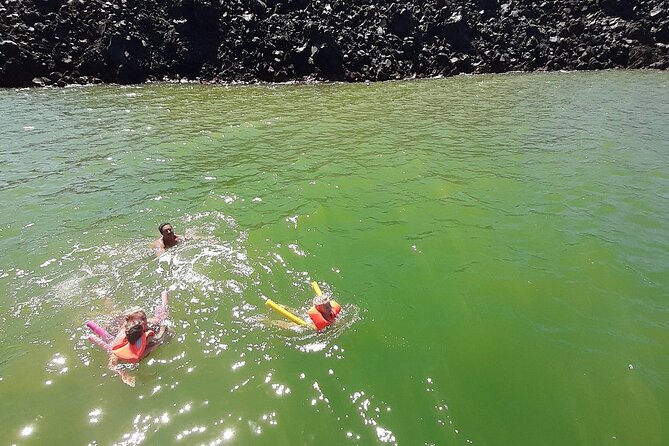 Santorini Semi-private Morning or Sunset Volcano Sailing Tour - Mavro Vouno shows Santorini’s dark volcanic side