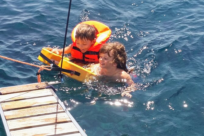 Santorini Semi-private Morning or Sunset Volcano Sailing Tour - Vlychada’s white cliffs open the route