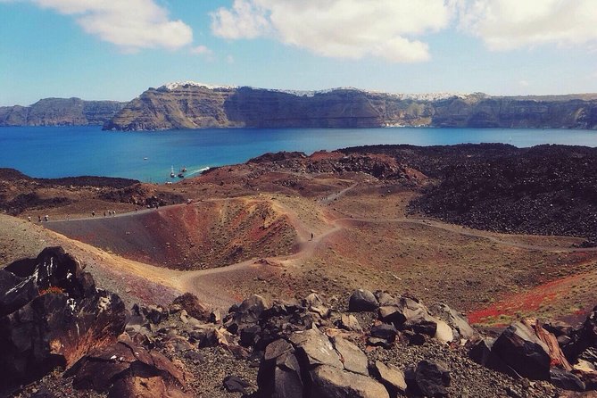 Santorini Volcanic Islands Cruise: Volcano, Hot Springs and Thirassia - Climbing Nea Kameni’s black volcanic slopes