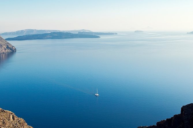 Santorini Volcanic Sunset Cruise - Seeing Santorini from below the cliffs