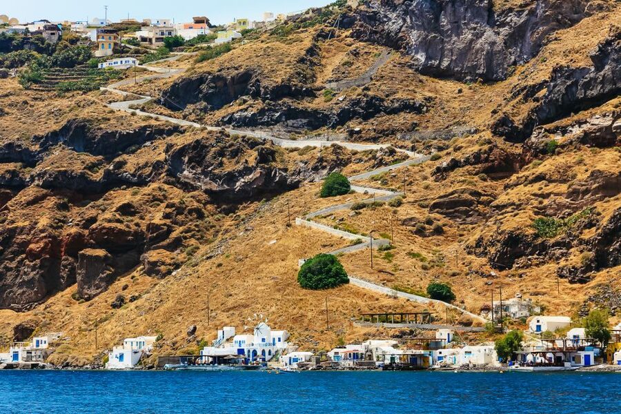 Santorini: Volcano and Hot Springs Sunset Dinner Cruise - Dinner, local wine, and a little dancing