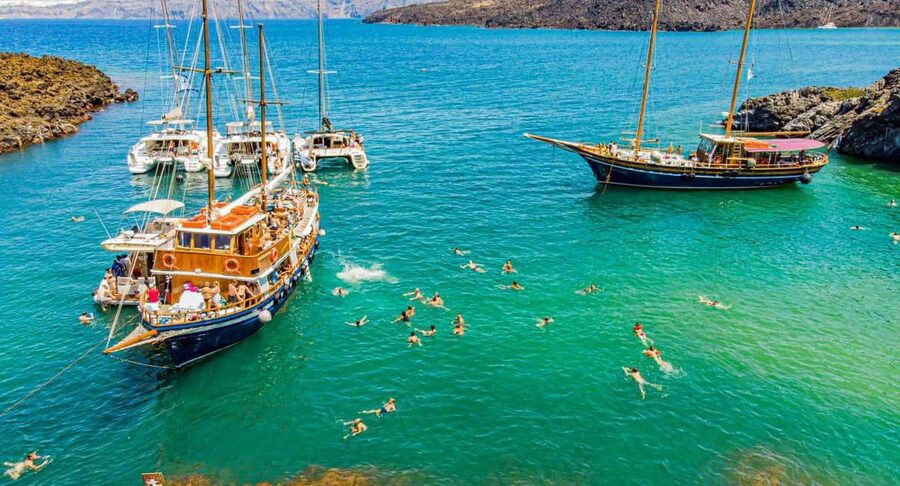 Santorini Volcano, Hot Springs Adventure - Sailing out from Fira and across the caldera