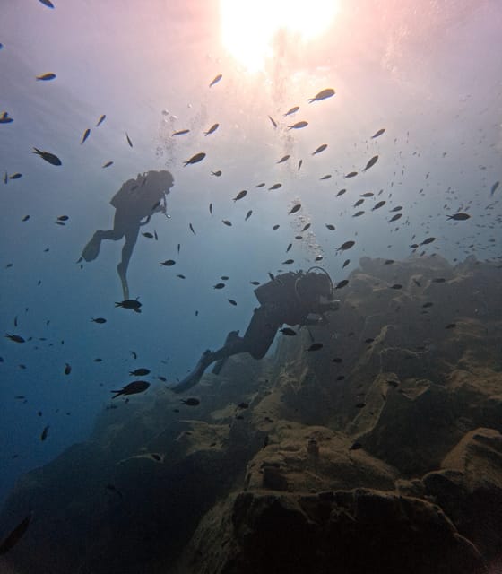 Scuba Diving in the Volcanic Caldera/shorelines of Santorini - The short speedboat ride and volcanic shorelines