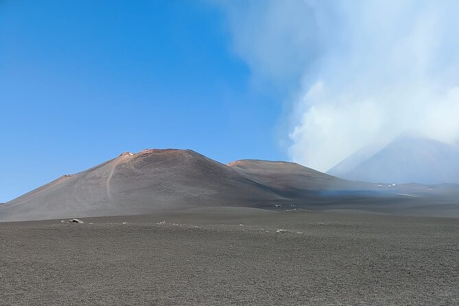 Tour to the Summit Craters of Etna 2920 meters with cable car and Jeep - Entering an Etna lava cave
