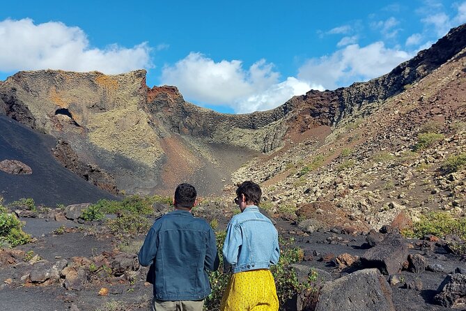 Trekking in the Volcanoes Natural Park in a small group - Walking into Lanzarote’s black volcanic country